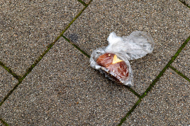 istock an old bread roll in a plastic bag on the street 2127504308