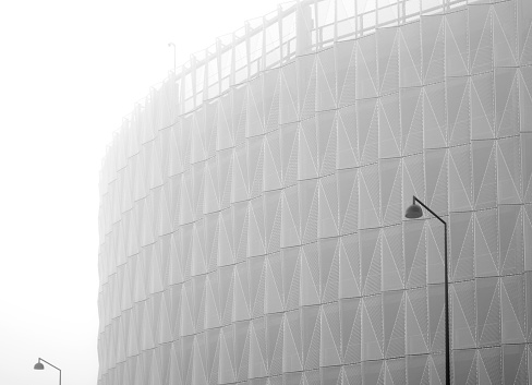 covered parking of modern architecture in the western port of Helsinki, Finland in heavy fog
