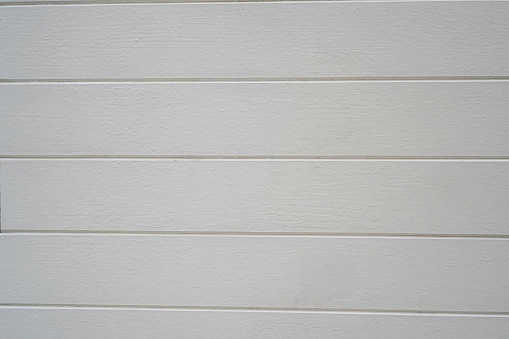 Image of white wood panels used as room walls or poolside fences with a beautiful contemporary design.