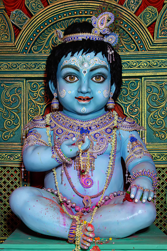 Idol of Goddess Laddu Gopal or little Lord Krishna at a decorated puja pandal in Kolkata, West Bengal, India.