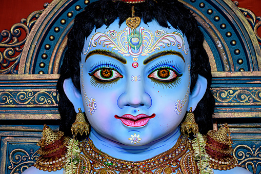 Idol of Goddess Laddu Gopal or little Lord Krishna at a decorated puja pandal in Kolkata, West Bengal, India.