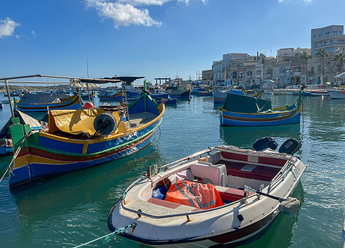 Fishing boats in the harbor of Marsaxlokk, Malta in a beautiful sunny day