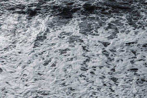 istock Sea waves near the coast at sunset. 2127569572