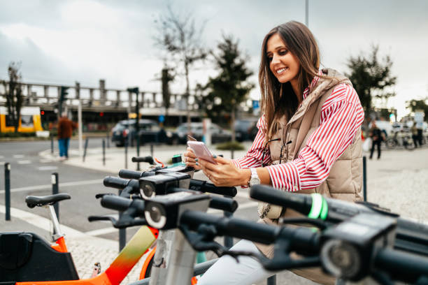 istock Happy young woman using ecological city transport. 2127575309