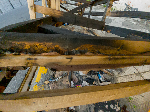 Vandalism very common in Brazil with sofa and trash burned on sidewalk near shopping center