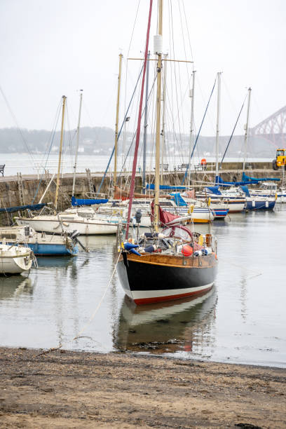Sailing boats moored at Scottish harbour