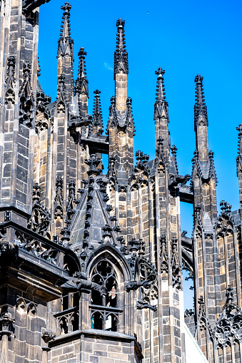 Detailed view of gothic spires and stonework on Prague historic cathedral