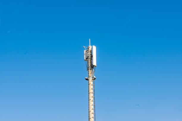 istock Isolated Communication Tower Rising into Clear Blue Sky 2127619412