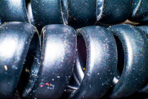 A mesmerizing macro photo capturing the coiled and textured details of spiral phone cables, revealing the intricate technology of connectivity.