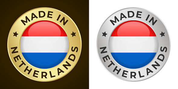 Made in Netherlands - Vector Graphics. Round Golden and Silver Label Badge Emblem Set with Flag of Netherlands and Text Made in Netherlands. Isolated on White and Dark Backgrounds