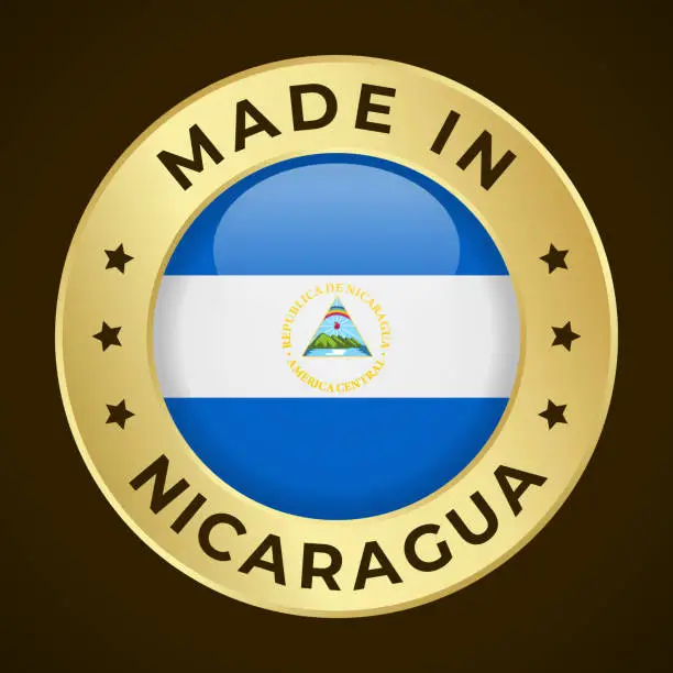 Vector illustration of Made in Nicaragua - Vector Graphics. Round Golden Label Badge Emblem with Flag of Nicaragua and Text Made in Nicaragua. Isolated on Dark Background