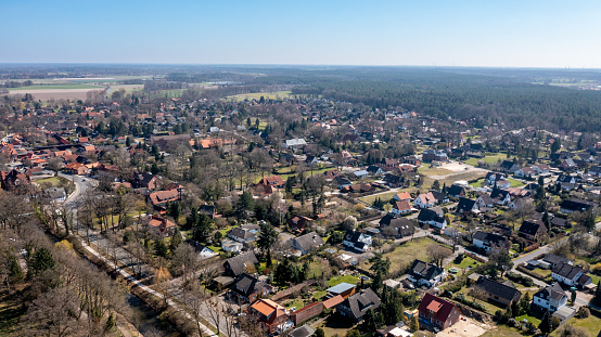Wienhausen, Lower Saxony - Germany - 03-30-2021: Elevated view of Wienhausen, showcasing dense trees and clustered residences