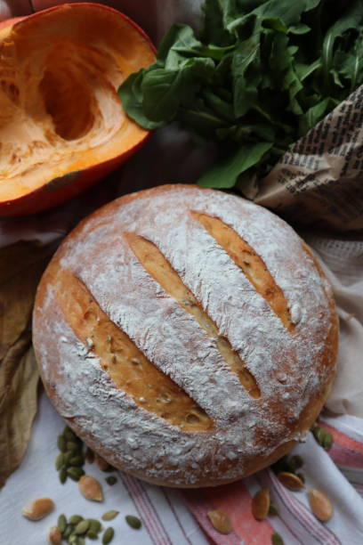 istock Homemade sourdough bread fresh baked with vegetables and greens decoration 2127683052