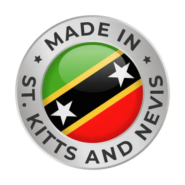 Vector illustration of Made in Saint Kitts and Nevis - Vector Graphics. Round Silver Label Badge Emblem with Flag of Saint Kitts and Nevis and Text Made in Saint Kitts and Nevis. Isolated on White Background