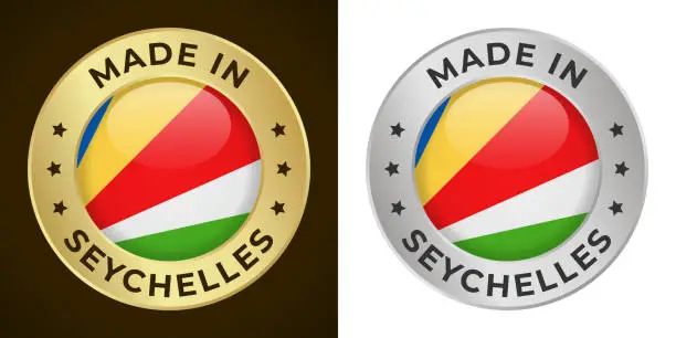 Vector illustration of Made in Seychelles - Vector Graphics. Round Golden and Silver Label Badge Emblem Set with Flag of Seychelles and Text Made in Seychelles. Isolated on White and Dark Backgrounds