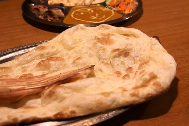 istock Naan and butter chicken curry. 2127694011