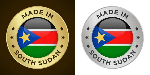 Vector illustration of Made in South Sudan - Vector Graphics. Round Golden and Silver Label Badge Emblem Set with Flag of South Sudan and Text Made in South Sudan. Isolated on White and Dark Backgrounds