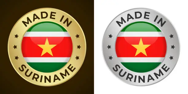 Vector illustration of Made in Suriname - Vector Graphics. Round Golden and Silver Label Badge Emblem Set with Flag of Suriname and Text Made in Suriname. Isolated on White and Dark Backgrounds