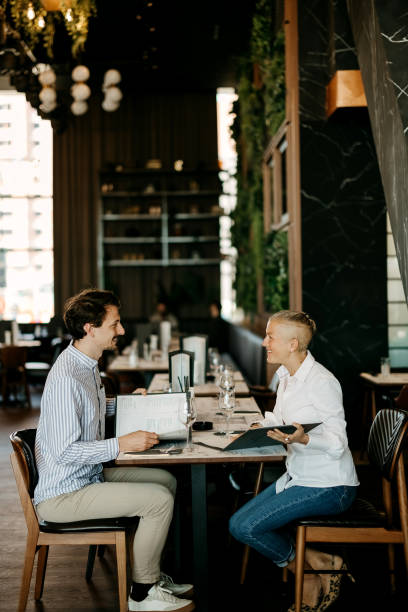 istock Business partners are discussing the menu in a restaurant 2127725906