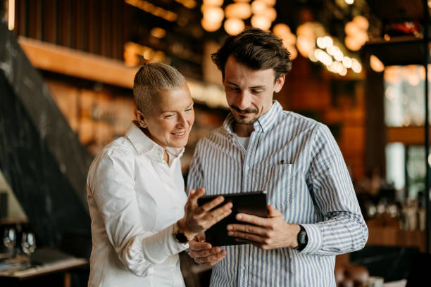 istock Man and a woman use a tablet 2127743496