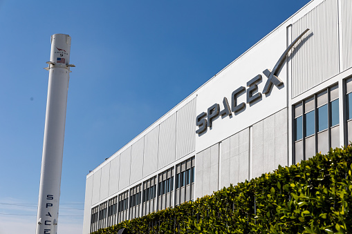 The Headquarters of SpaceX in Hawthorne, California, with a Falcon 9 booster in March 2024.