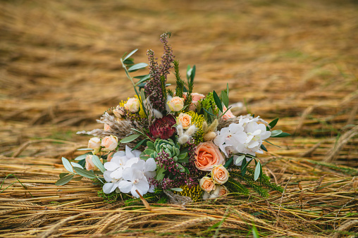 Boho style wedding bouquet on the ground