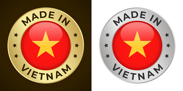 Made in Vietnam - Vector Graphics. Round Golden and Silver Label Badge Emblem Set with Flag of Vietnam and Text Made in Vietnam. Isolated on White and Dark Backgrounds