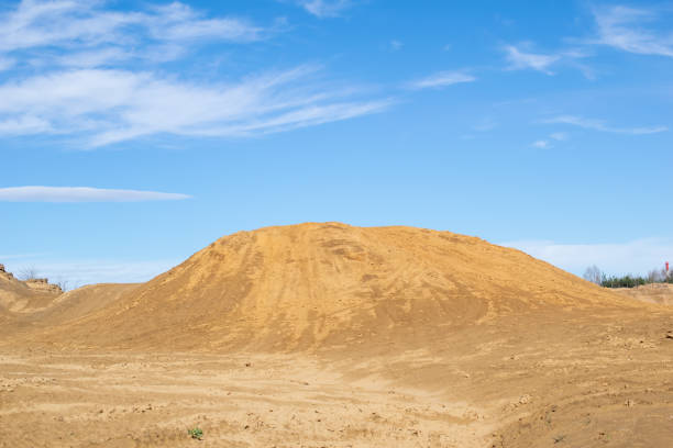dunes of yellow sand against the sky