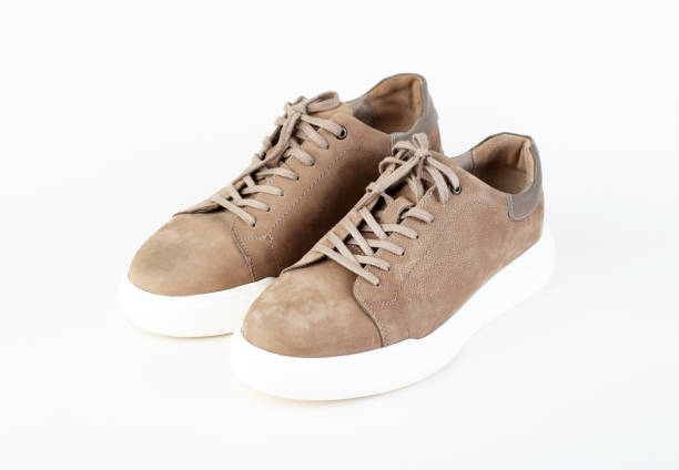 istock Pair of comfortable suede shoes on white background 2127784124