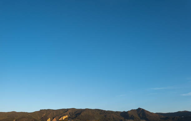 istock Blue sky with mountains and some clouds during a sunny day at noon 2127785703