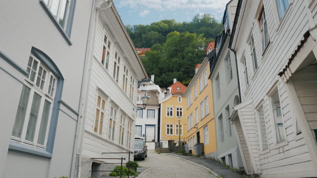 A narrow street with beautiful old wooden houses in Bergen, Norway