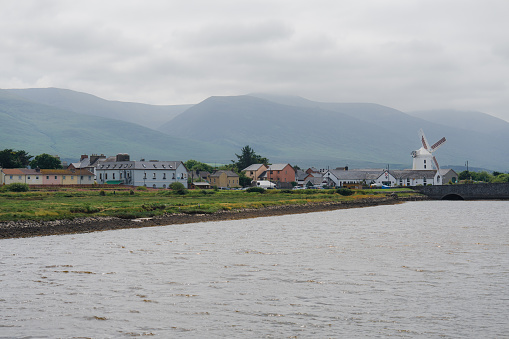 Historic Blennerville windmill in Irish countryside visible from water