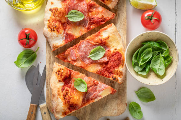 istock Fresh and traditional pizza baked at home oven. 2127847621