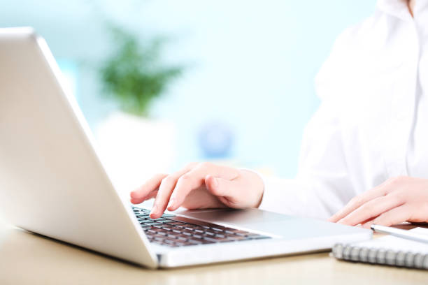 istock Female hand typing on laptop keyboard 2127903361