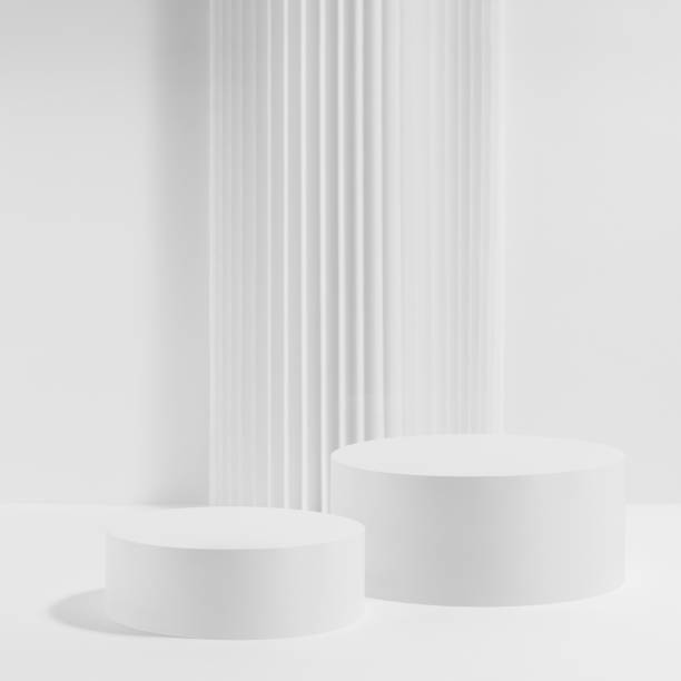 istock Two white round podiums with striped column as geometric decor, set, mockup on white background. Template for presentation cosmetic products, gifts, goods, advertising, design in modern style. 2127913906