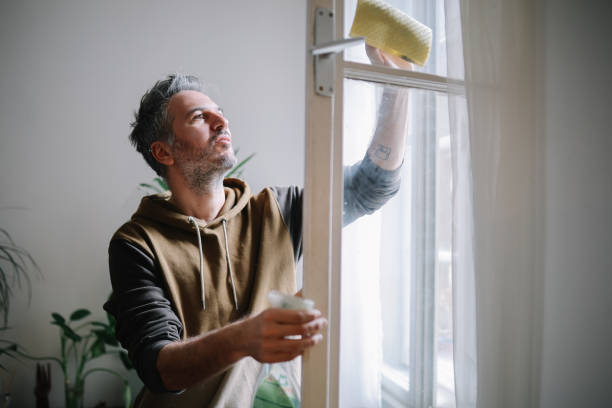 istock man cleaning apartment windows 2127947108