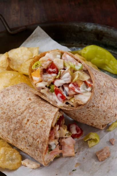Chargrilled tortilla wraps on a plate isolated against white