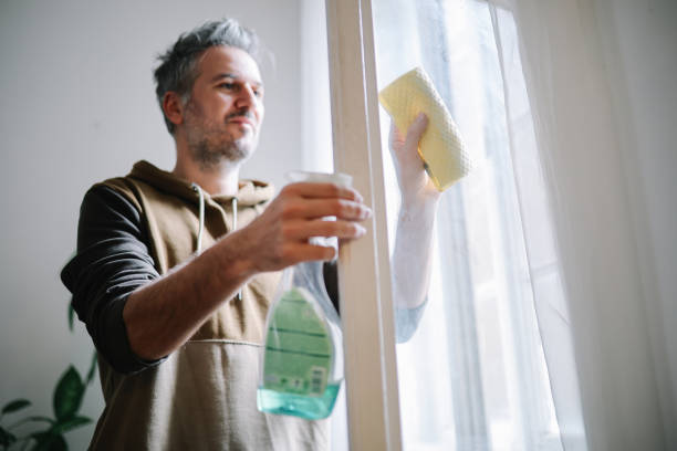 istock man cleaning apartment windows 2127958062