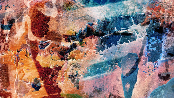 High resolution old weathered polychrome concrete wall detail, coated with multiple layers of various paints, applied through the years randomly one on top of the other, slowly cracking and peeling off, run down by the elements, high resolution grunge background texture stock photo.
