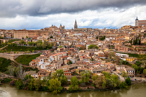 General view of Toledo, Castila la Mancha, Spain, world heritage city, with the Tagus River in the foreground