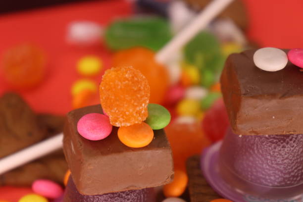 istock Gems and candies on the brown cadbury chocolate 2128043002