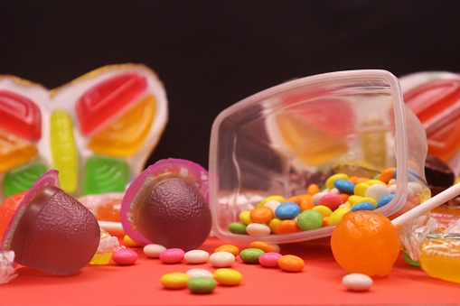 Colorful jelly with lollipop in the plastic box