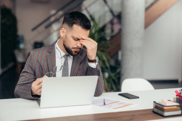 istock Worried and Exhausted Businessman 2128080589