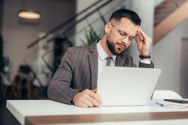istock Worried and Exhausted Businessman 2128080590