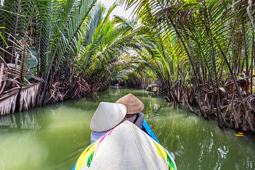 Few tourists on boat in Mekong River Delta, Vietnam