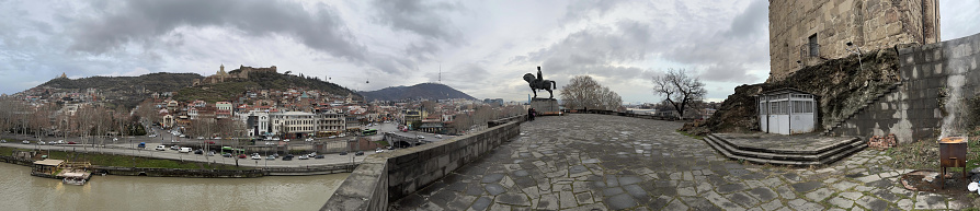 Old Tbilisi panoramic view with clouds like smoke and expressive.