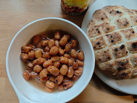 Fava Beans, is a national Egyptian dish that can be prepared in numerous variations and is served around the clock, even in popular restaurants. Here is the version with cucumber, onions, tomatoes, garlic and 