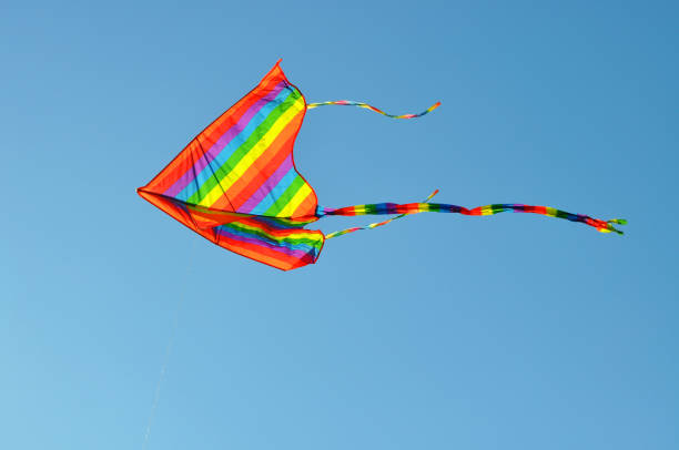 istock Colorful kite flying in clear sky 2128168285