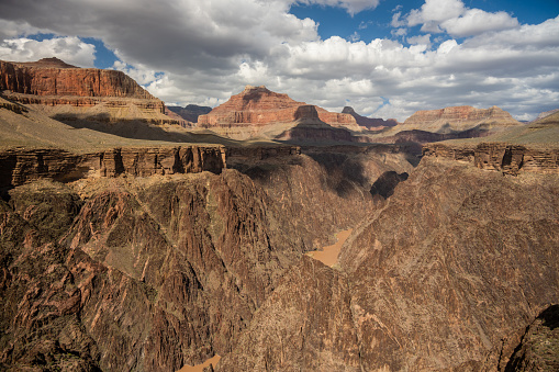 Shadows Dot The Walls of Grand Canyon HIgh Above The Colorado River on cloudy day
