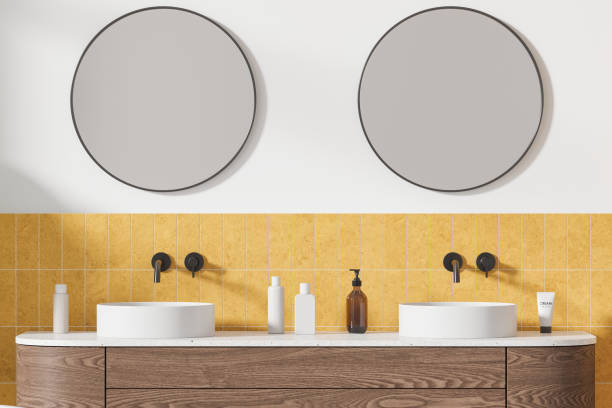 istock Stylish hotel bathroom interior with double sink and accessories on vanity 2128254124